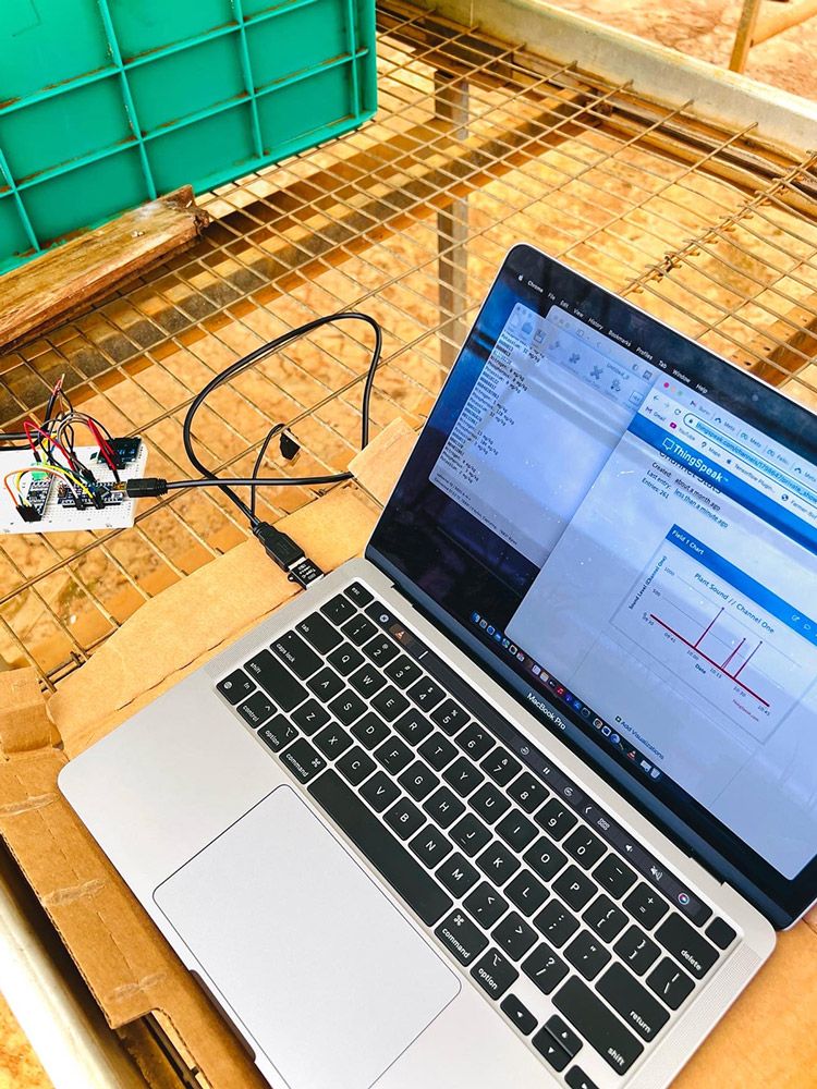 A laptop with ThingSpeak on the screen reading data from an SD card.