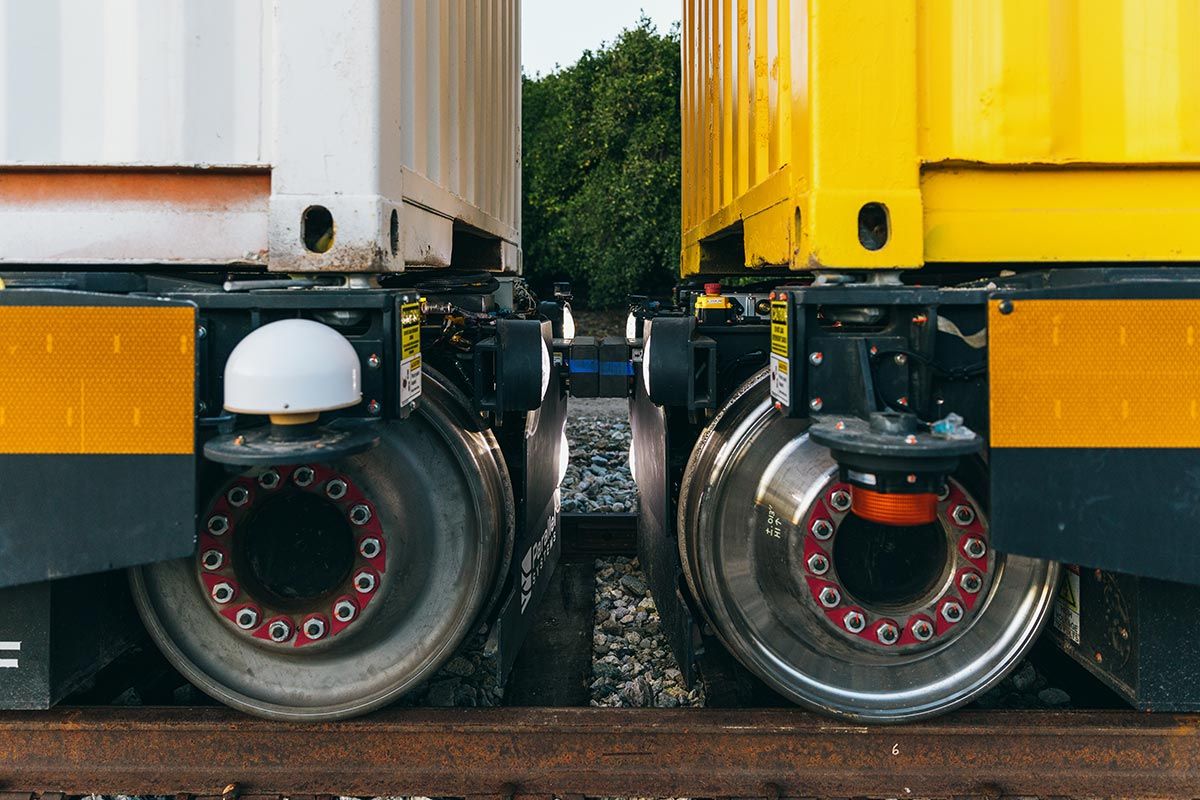 Close-up of the connection point between two rail cars.