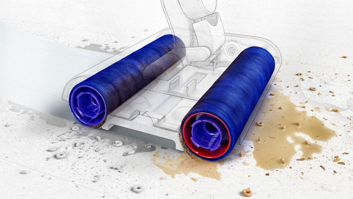 An illustration showing the absorbency of the Dyson rollers cleaning a wet surface with debris.