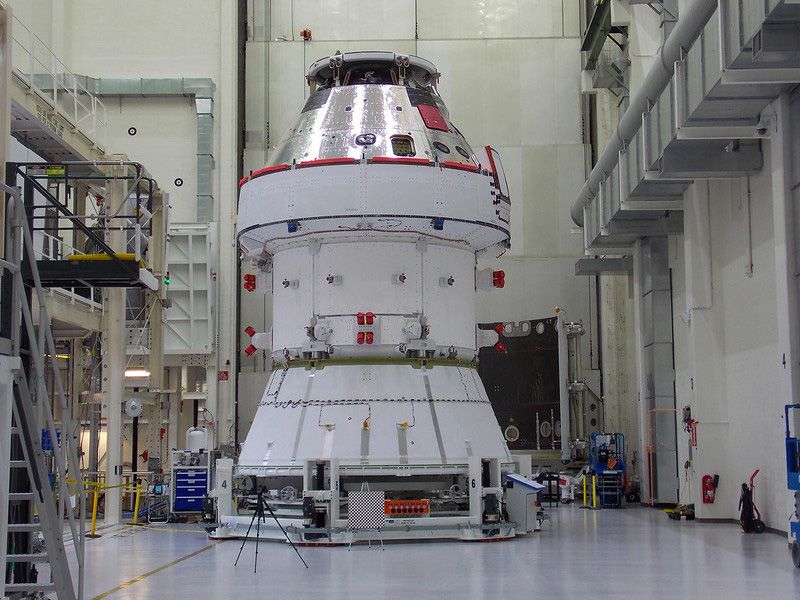 The Orion spacecraft inside a large room.