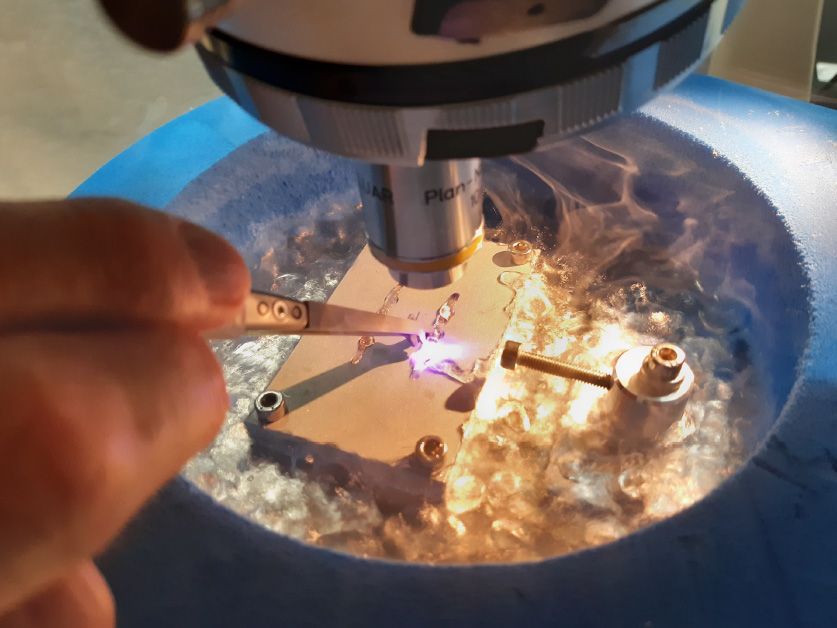 A close-up view of the widefield light microscope.