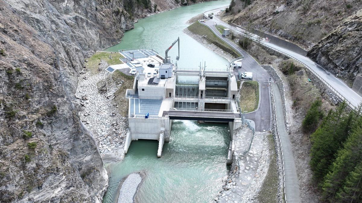 A power plant constructed across the Upper Inn River in the border region between Austria and Switzerland. The plant includes a recently constructed dam.
