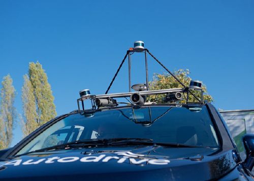 Multiple lidars mounted on top of a car.